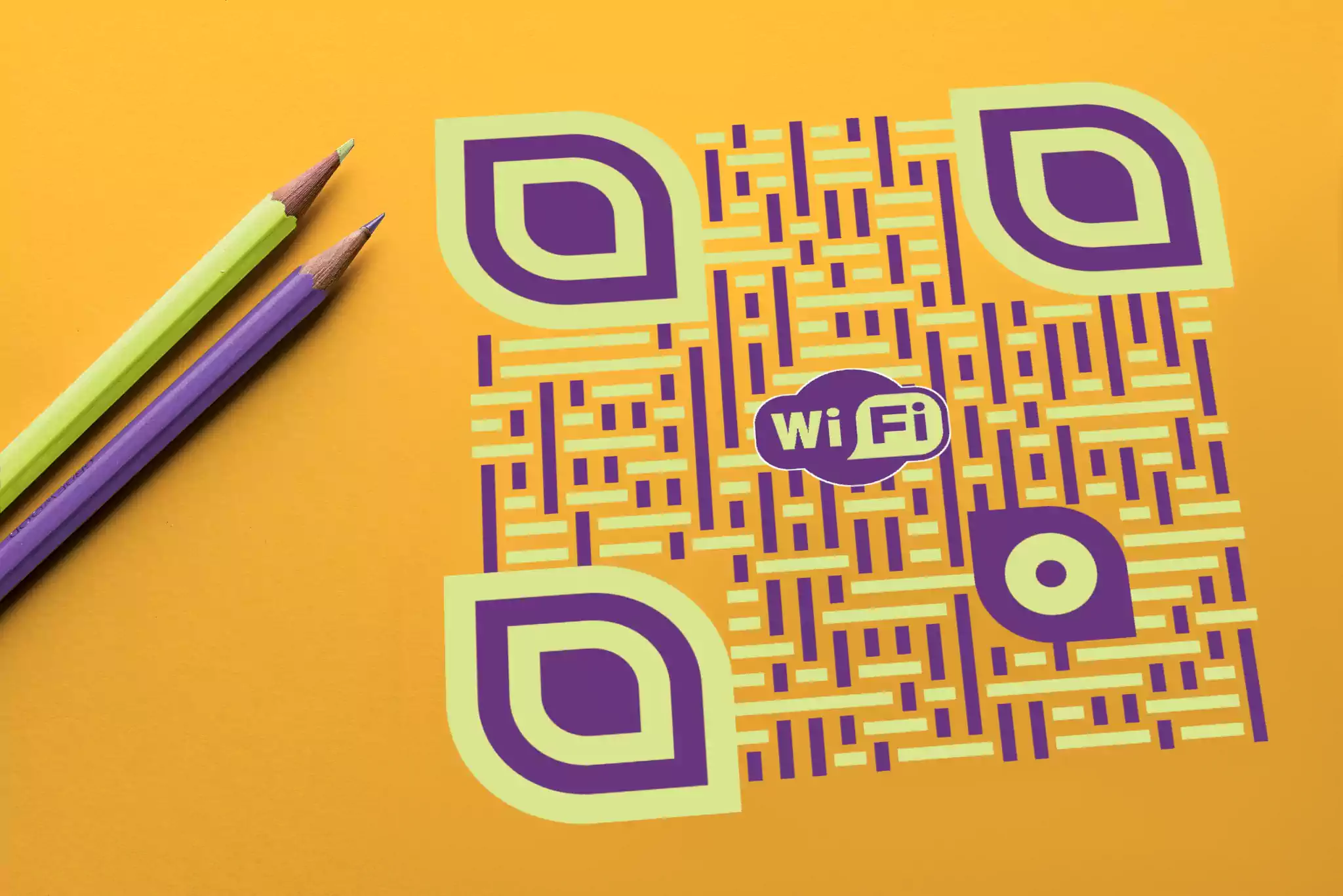 QRcodeLab qr generator - custom QR code with woven-style data pattern near color pencils on a table